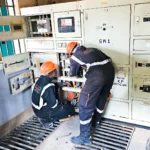 Power upgrade project. Technicians decommissining old switchboard so as to install new switchboard.