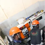 Power upgrade project. Technicians installing main breaker panel and termination of main power cable.
