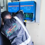 Inverter Battery power backup project. A technician installaling Victron Power backup in a server room