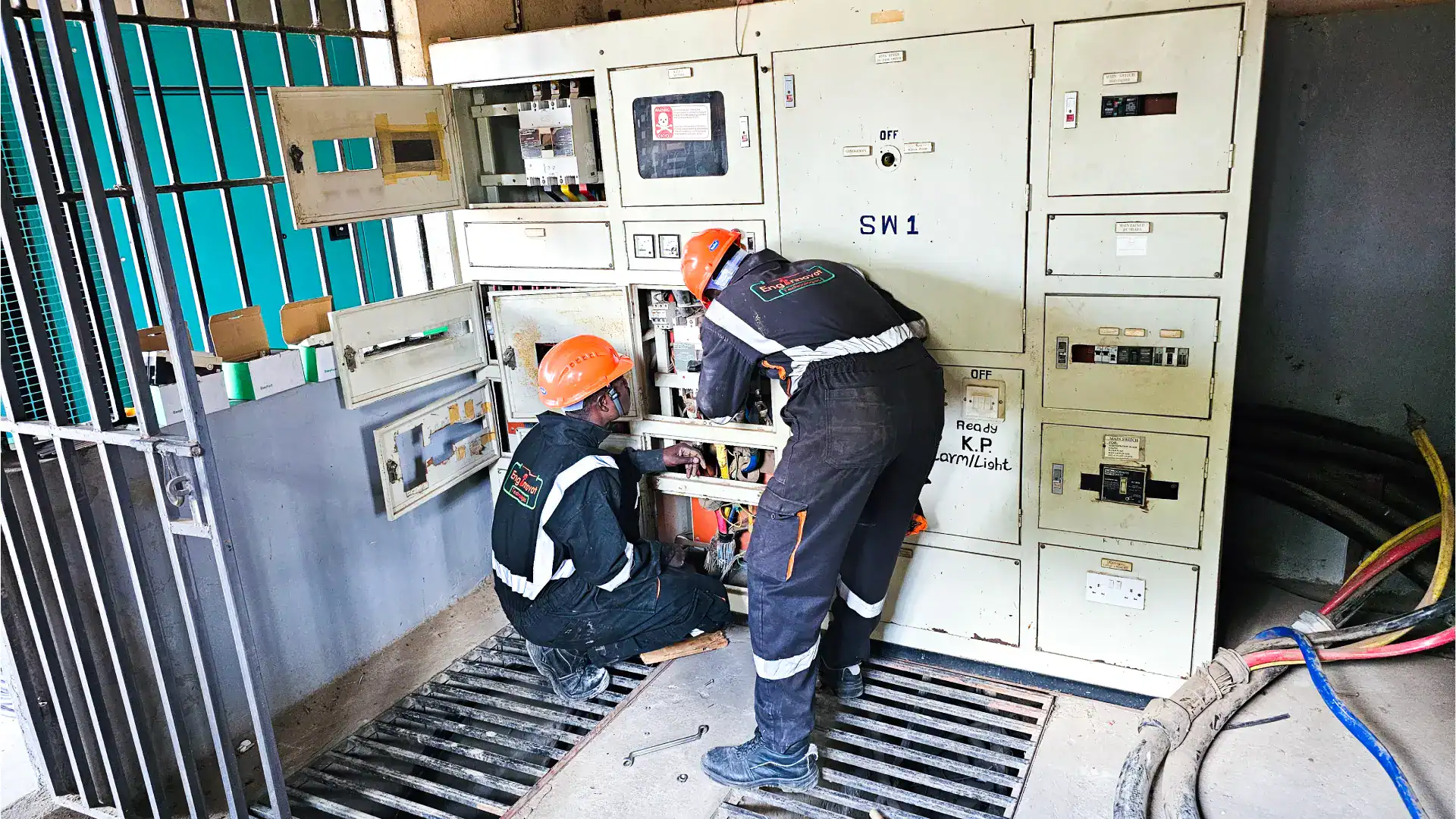 The photo shows our technicians decommissining old switchboard so as to install new switchboard.