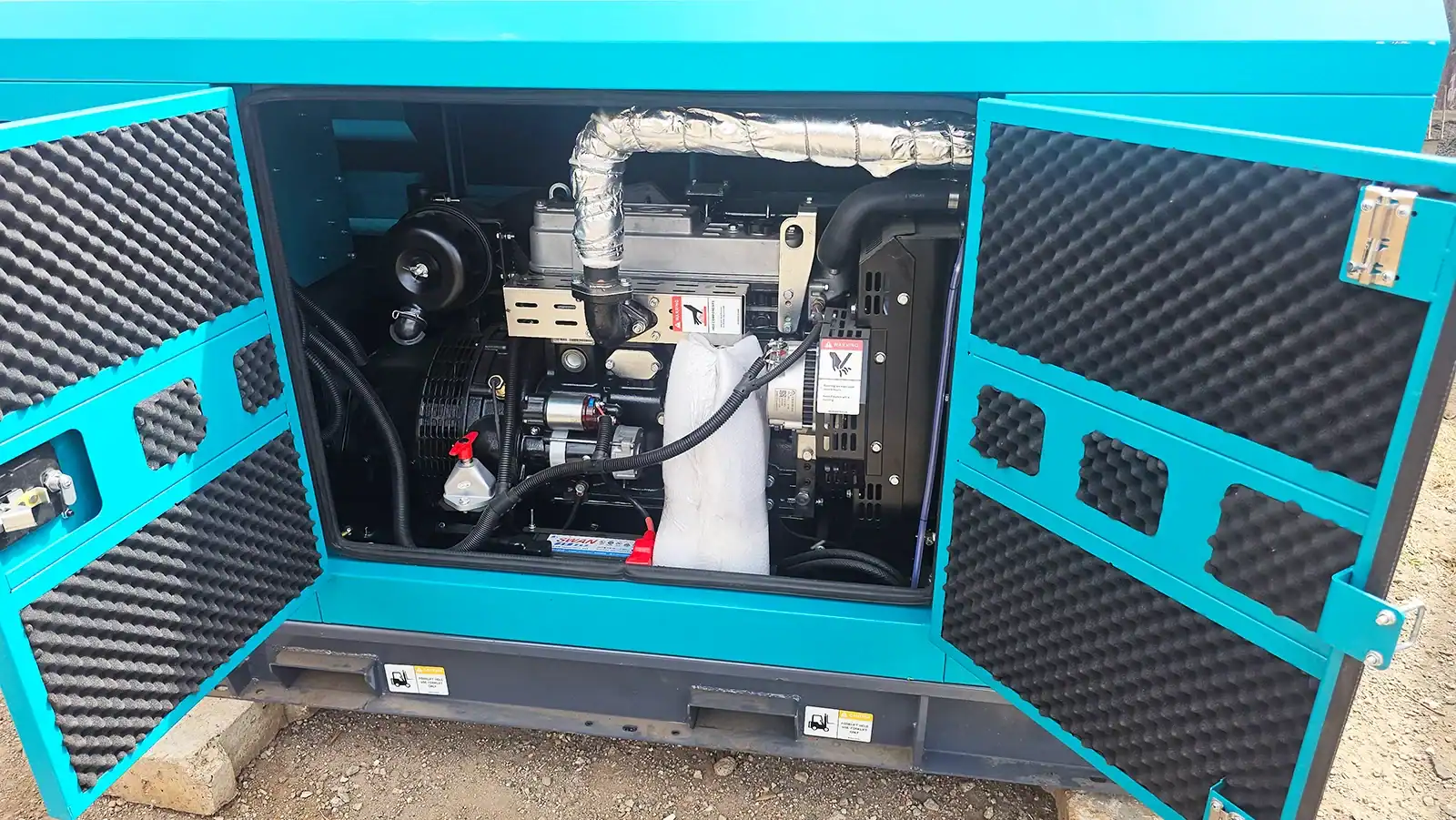 28kVA diesel generator being inspected and tested before delivery for backup power installation.