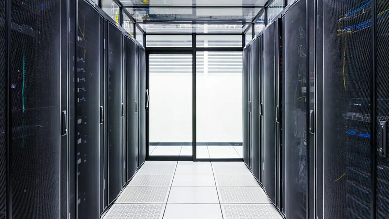 In-row cooling system in a data centre with aligned server racks and controlled airflow for efficient thermal management.