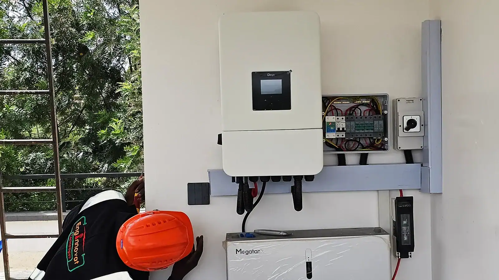 Hybrid solar inverter with battery storage installed for residential backup power system.