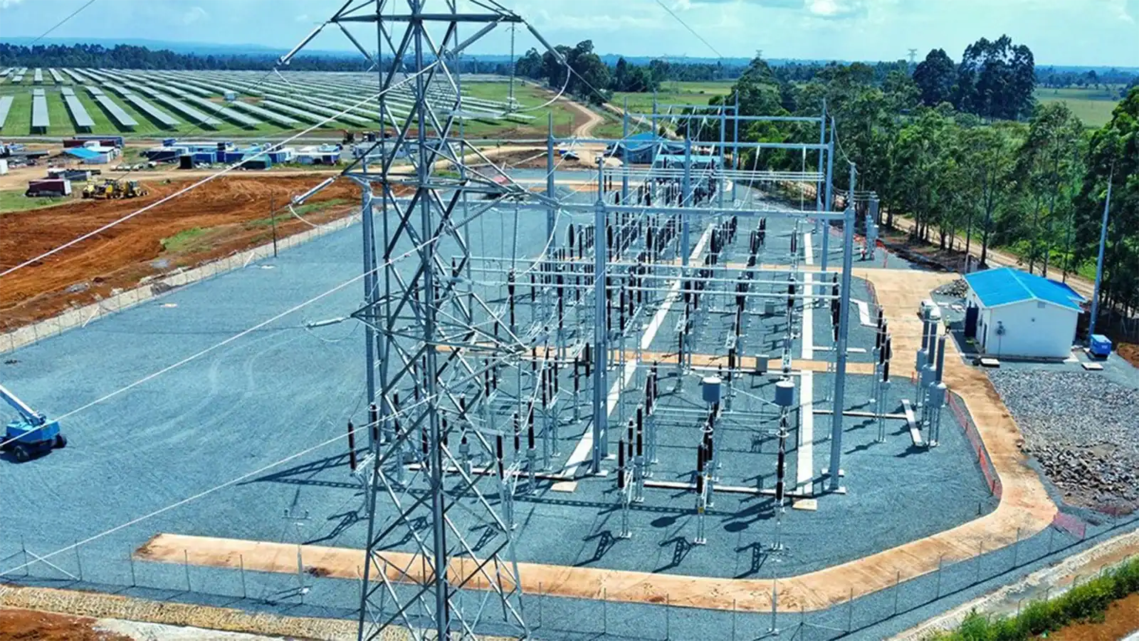 Solar power plant integrated with electrical substation for grid connection and power distribution.