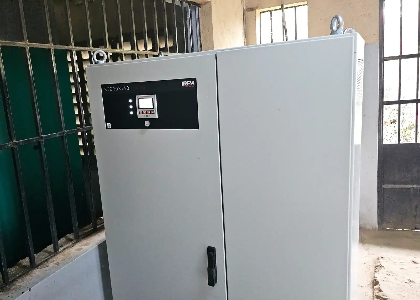 A close up front view of completed installation of a 410 kVA automatic voltage regulator in a power room.