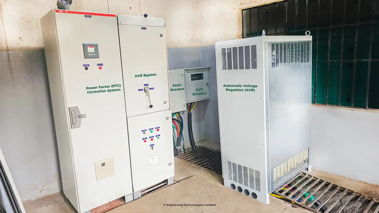 Completed installation of an IREM 410 kVA Automatic Voltage Regulator and new main breaker panel in a university electrical room.